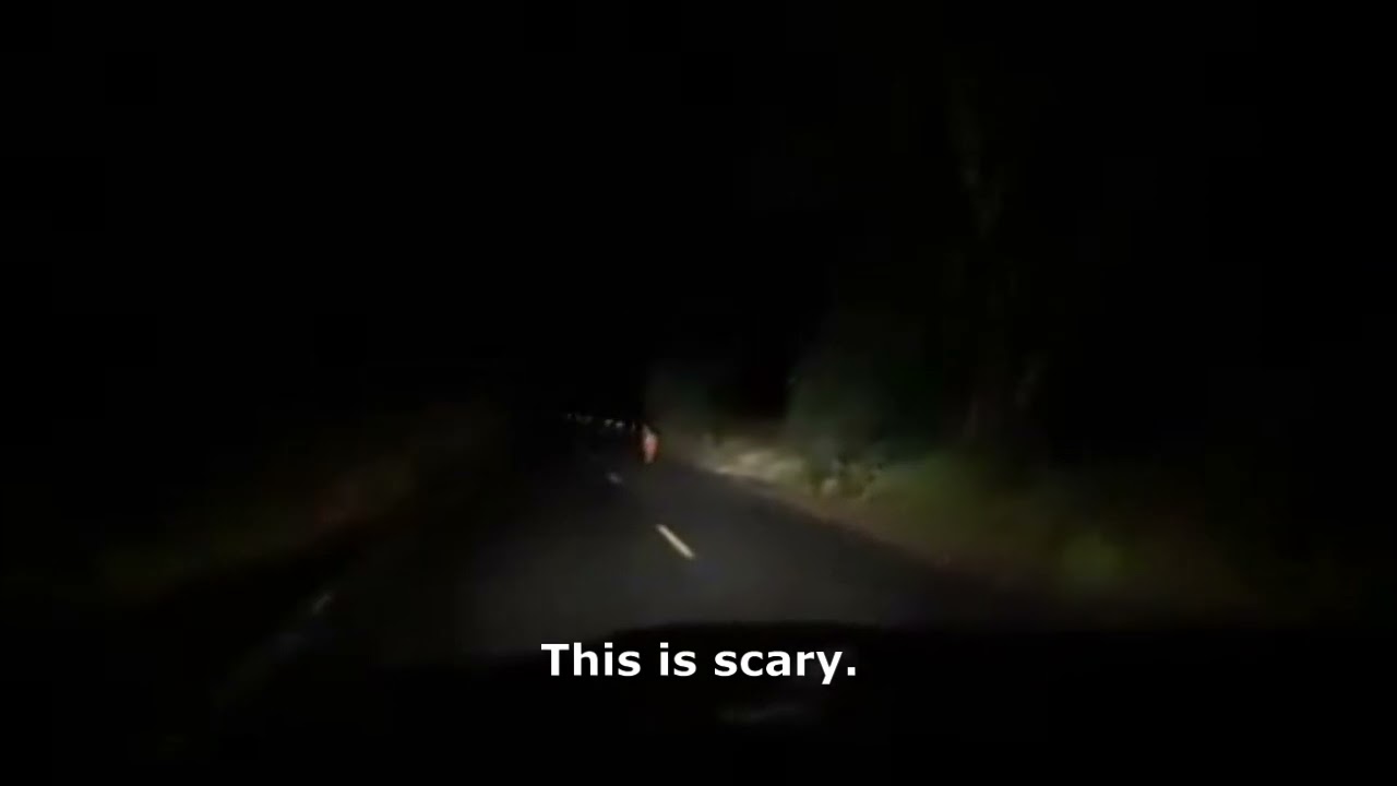 Little girl lost in dark, rainy road in Surin